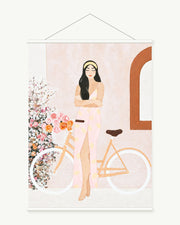 Bicycle Through Blossoms art print with included white cylindrical hanging rods
