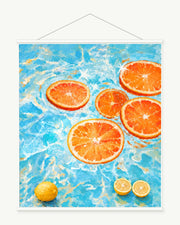 Oranges in Blue Water art print with included white cylindrical hanging rods