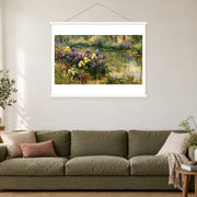 Iris Bank in Dappled Light, shown as a complete bordered art print with white hanging rods above a sofa in a living room.