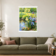 Blue Irises Beside the Brook, shown as a complete bordered art print with white hanging rods above a sofa in a living room.