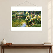 White Irises on the Shaded Bank, shown as a complete bordered art print with white hanging rods above a console in a closer room view.