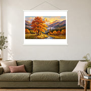 Autumn Tree Beneath Golden Peaks, shown as a complete bordered art print with white hanging rods above a sofa in a living room.