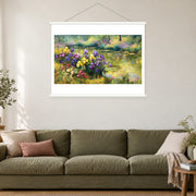 Violet Irises at Summer's End, shown as a complete bordered art print with white hanging rods above a sofa in a living room.