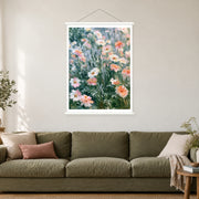 Blush Wildflowers in the Breeze, shown as a complete bordered art print with white hanging rods above a sofa in a living room.