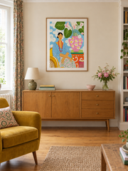 Woman Among Garden Blooms — styled room view with an optional frame
