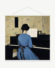 Woman at the Piano art print with included white cylindrical hanging rods