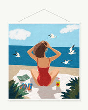 Woman Facing the Sea art print with included white cylindrical hanging rods